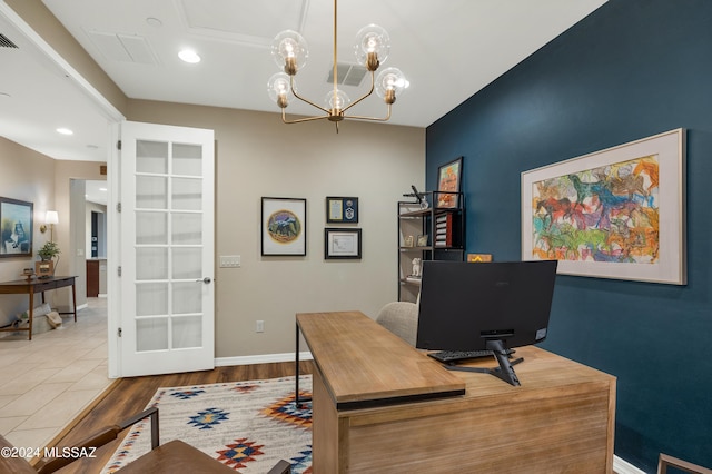 office with french doors, a chandelier, and light wood-type flooring