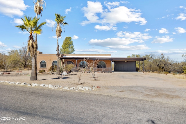 view of front of home with a carport