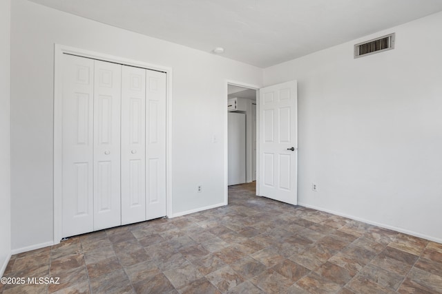 unfurnished bedroom featuring a closet