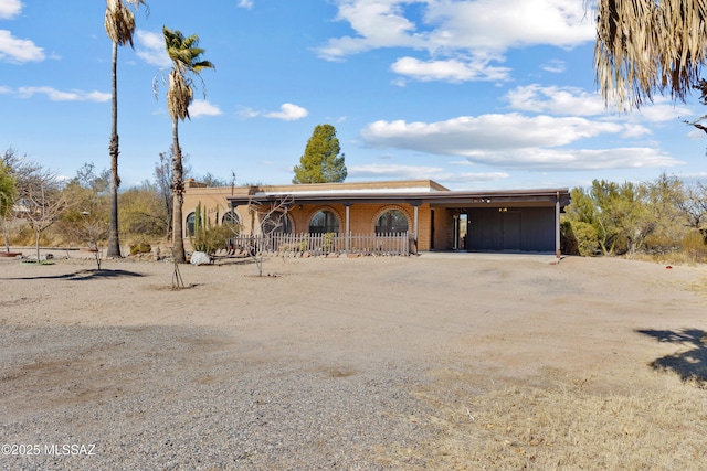 view of front facade with a carport