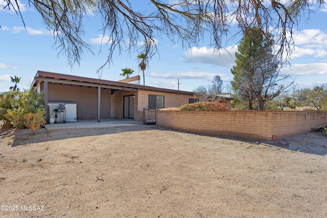 back of property featuring a patio area