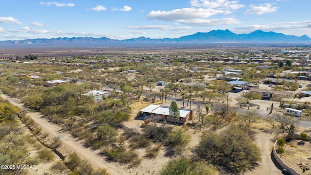 birds eye view of property featuring a mountain view