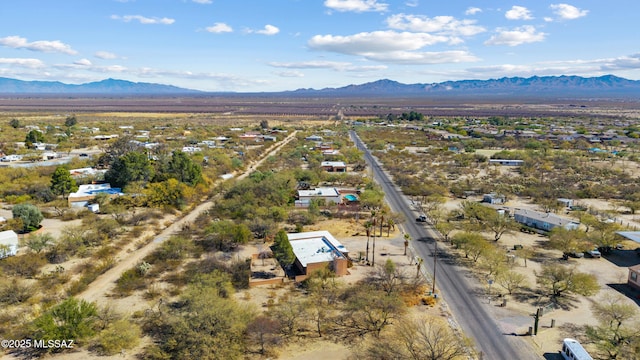 birds eye view of property featuring a mountain view