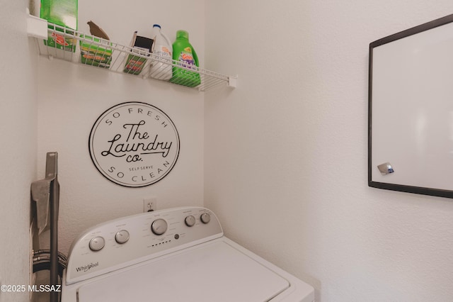 clothes washing area with washer / dryer