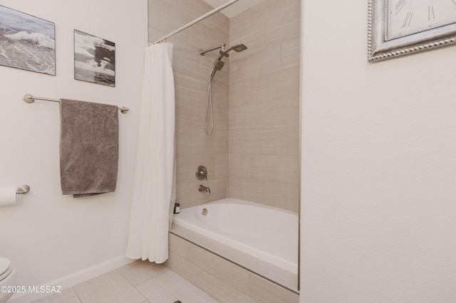 bathroom with shower / tub combo, tile patterned floors, and toilet