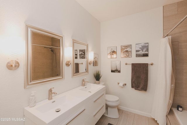 bathroom with vanity, toilet, and a shower with shower curtain