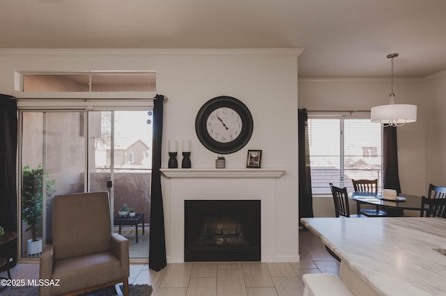 living room featuring crown molding and a wealth of natural light