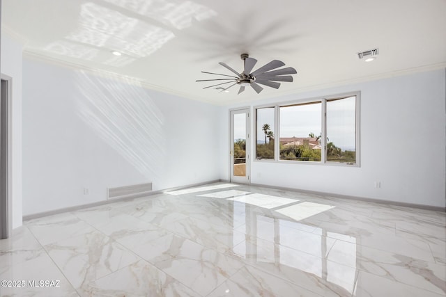 spare room with crown molding and ceiling fan