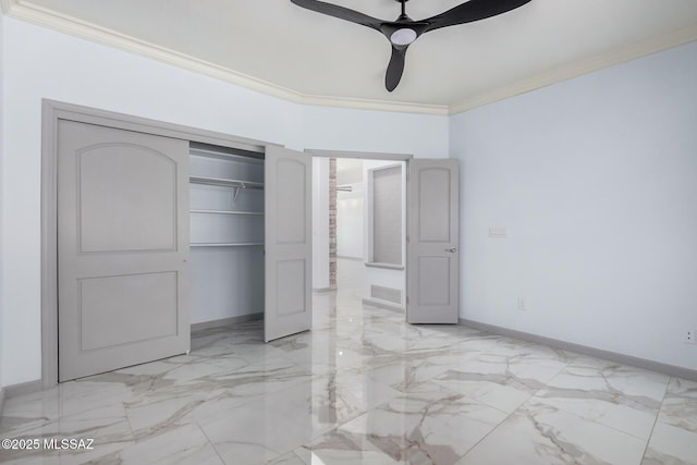 unfurnished bedroom with crown molding, a closet, and ceiling fan