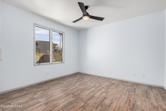 unfurnished room featuring ceiling fan and light hardwood / wood-style flooring