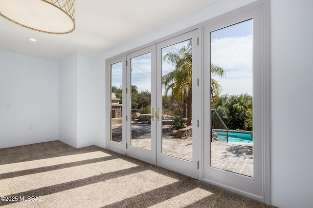 doorway featuring french doors and carpet floors