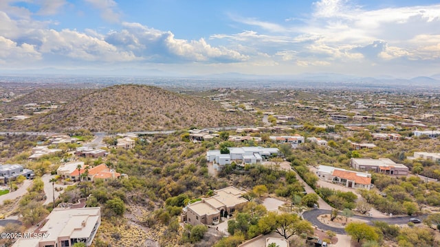 birds eye view of property with a mountain view