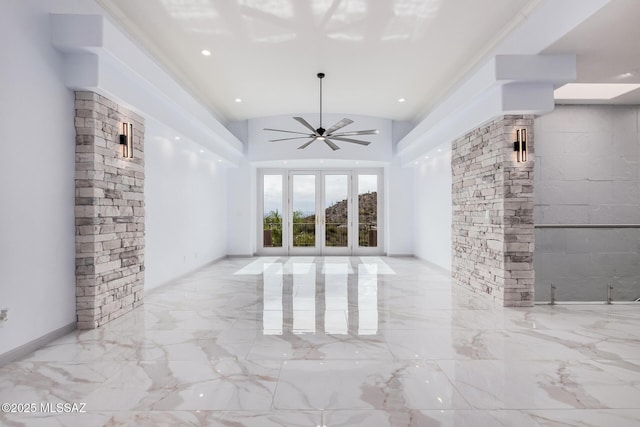 unfurnished living room with vaulted ceiling and ceiling fan