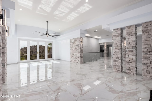 unfurnished living room with french doors and ceiling fan