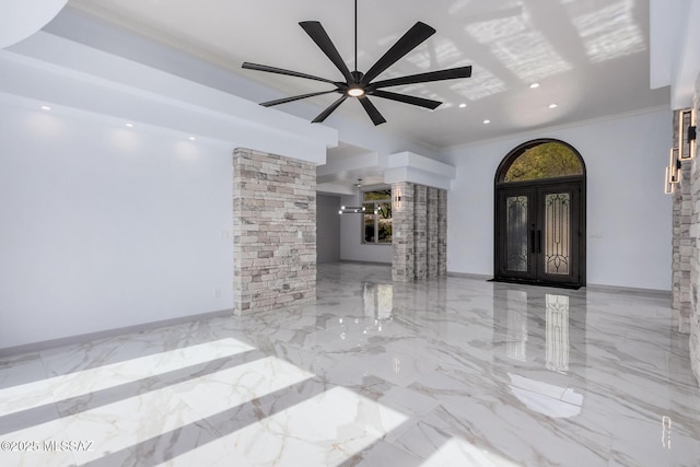 unfurnished living room with crown molding and ceiling fan