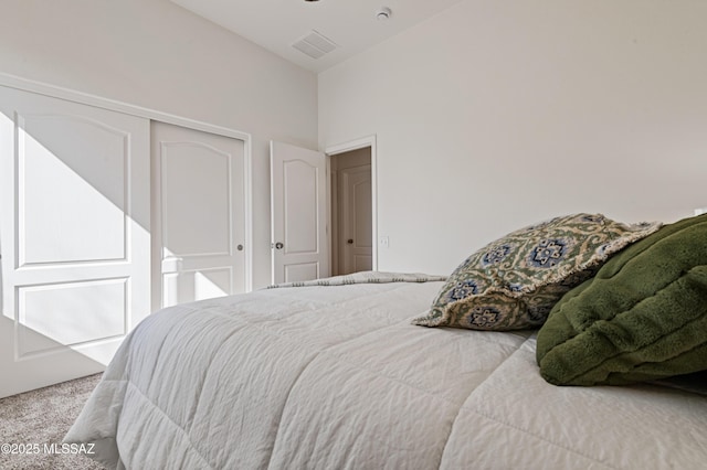 carpeted bedroom featuring a closet