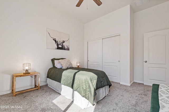 carpeted bedroom with a closet and ceiling fan