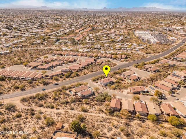 birds eye view of property with a mountain view