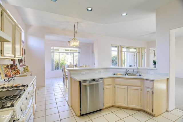 kitchen with a wealth of natural light, pendant lighting, sink, and stainless steel dishwasher