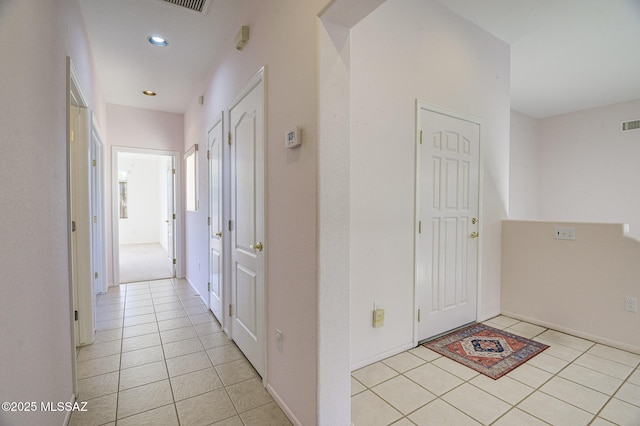 hallway with light tile patterned floors