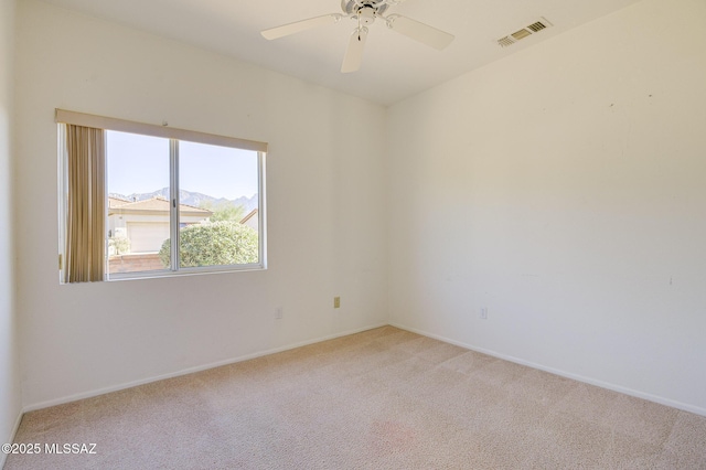 2283 E Buster Mountain Dr, Oro Valley, AZ 85755 - spare room with light carpet and a ceiling fan