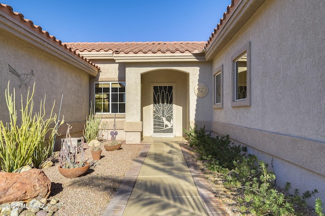 property entrance with a patio area