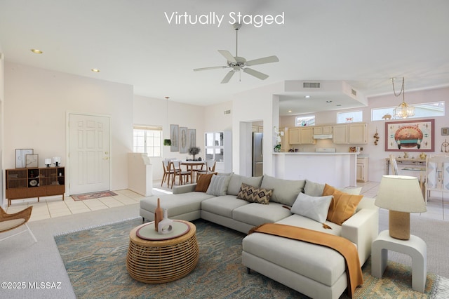 living room featuring ceiling fan and light tile patterned floors