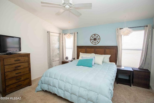 bedroom with light carpet, ceiling fan, and lofted ceiling