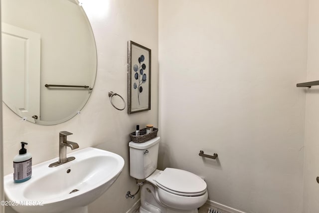 bathroom featuring sink and toilet