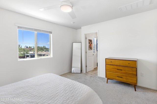 bedroom featuring light carpet, ceiling fan, visible vents, and baseboards