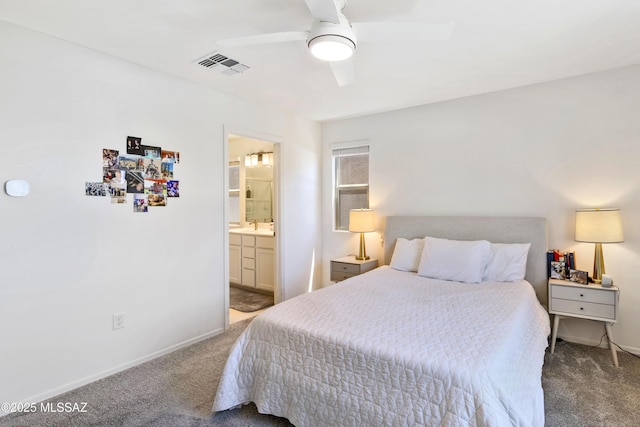 bedroom featuring baseboards, visible vents, ensuite bath, and carpet flooring