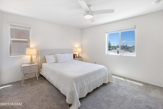 bedroom with a ceiling fan and carpet flooring