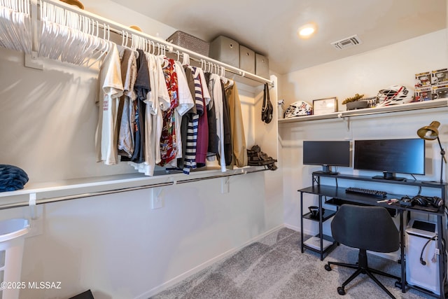 walk in closet with carpet floors and visible vents