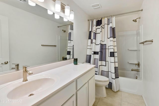 full bathroom featuring toilet, tile patterned floors, visible vents, vanity, and shower / tub combo with curtain