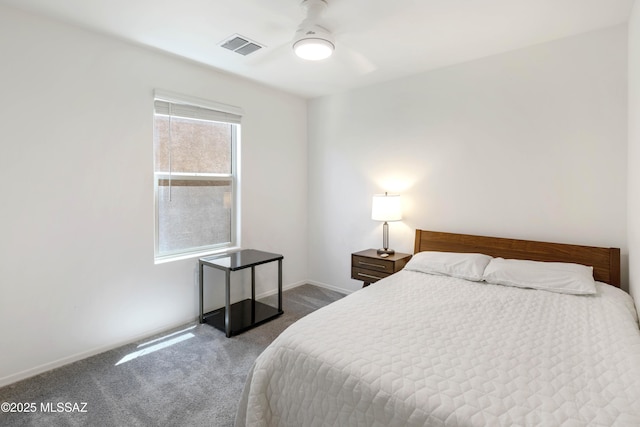 carpeted bedroom featuring visible vents