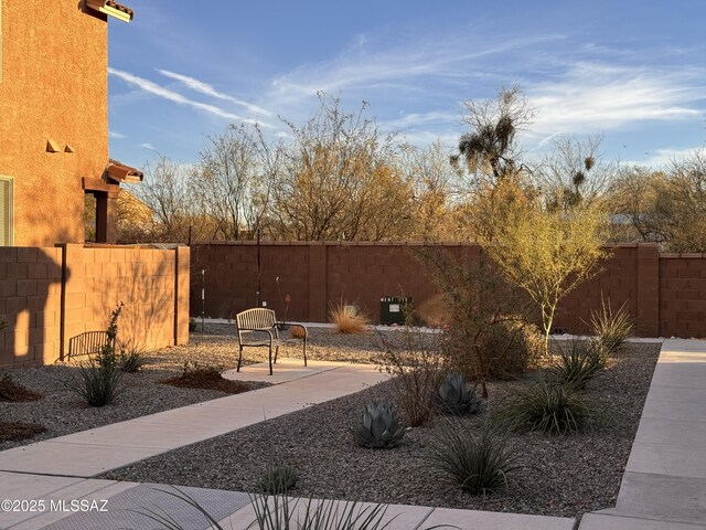 view of side of home with a patio