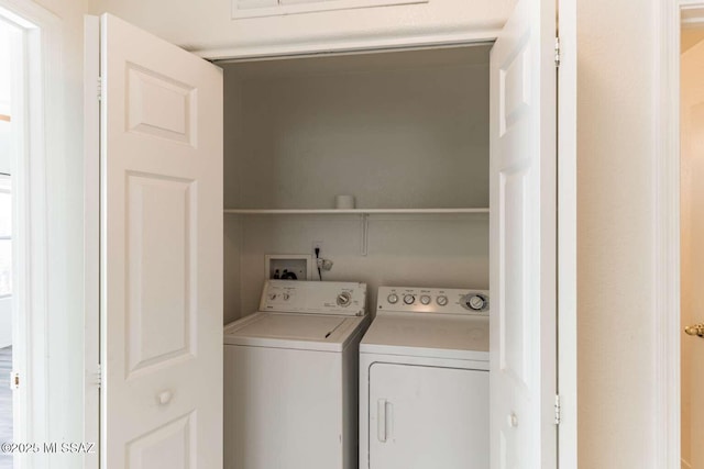 laundry room with independent washer and dryer