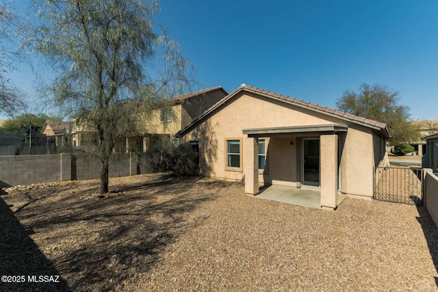 rear view of property with a patio