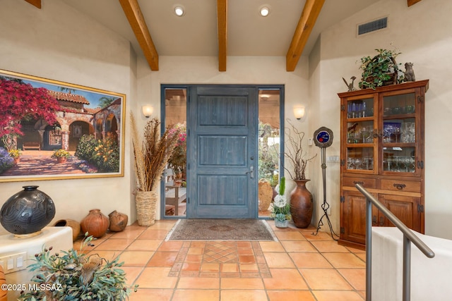 foyer entrance with light tile patterned floors, beamed ceiling, visible vents, and recessed lighting