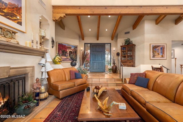 tiled living room featuring recessed lighting, visible vents, vaulted ceiling with beams, and a lit fireplace