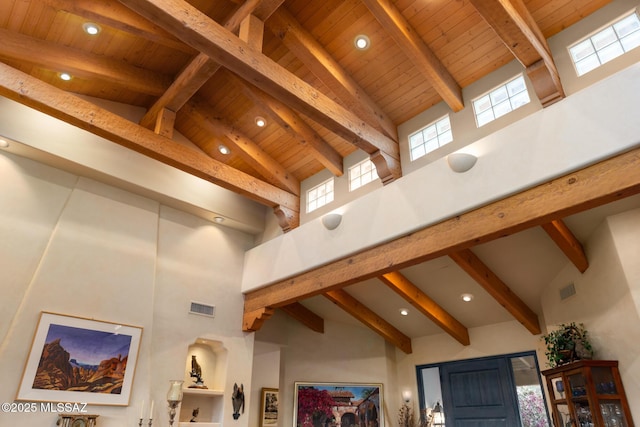 interior details featuring beamed ceiling, wooden ceiling, and visible vents