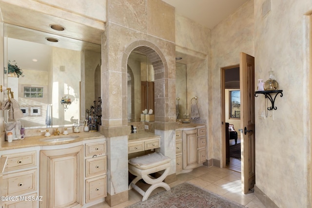 bathroom with tile patterned flooring and vanity