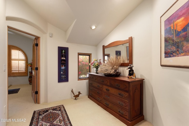 hall featuring carpet floors, vaulted ceiling, and recessed lighting