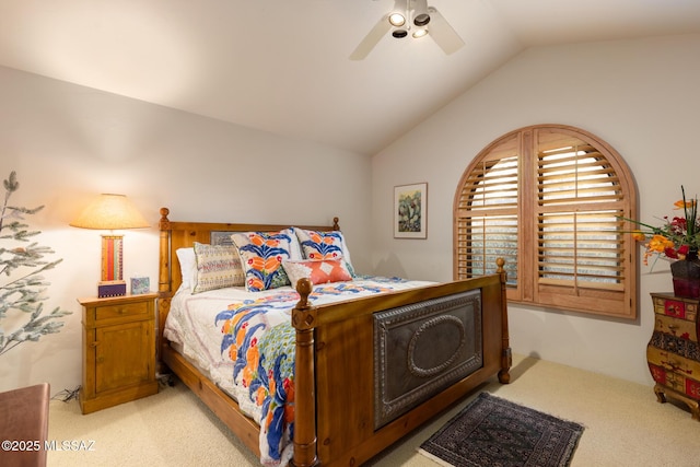 bedroom featuring lofted ceiling, ceiling fan, and light colored carpet