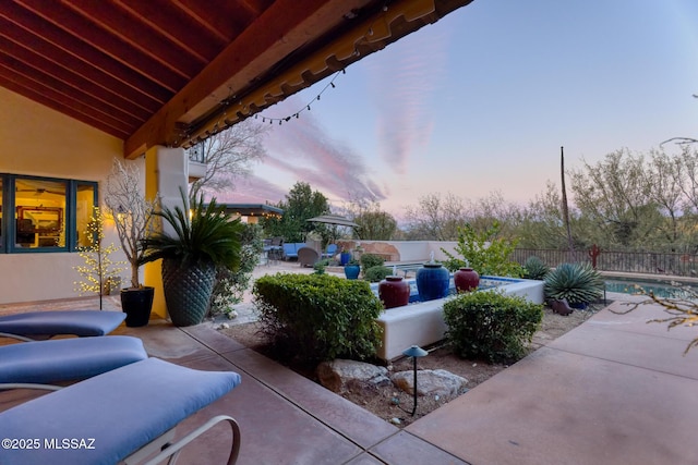 view of patio / terrace featuring a fenced backyard and a fenced in pool