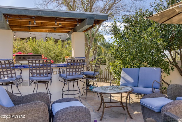 view of patio / terrace with fence and an outdoor hangout area