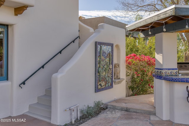 view of side of home featuring stucco siding