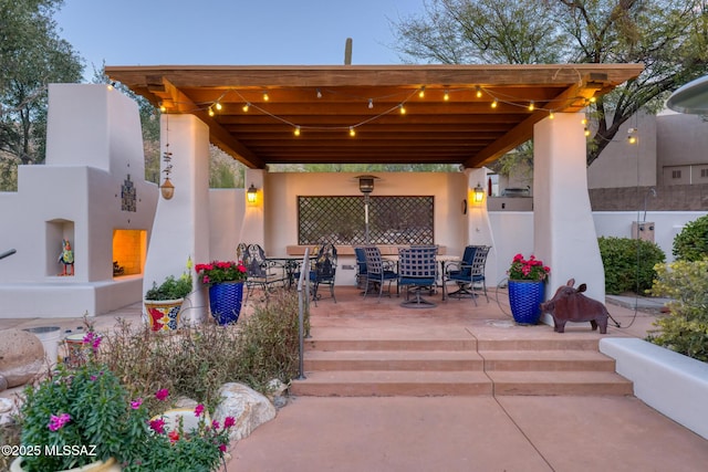 view of patio / terrace featuring fence and outdoor dining area