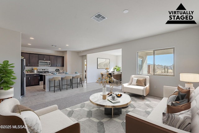 living room featuring light tile patterned floors