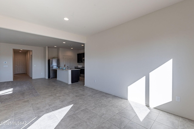 unfurnished living room with light tile patterned floors